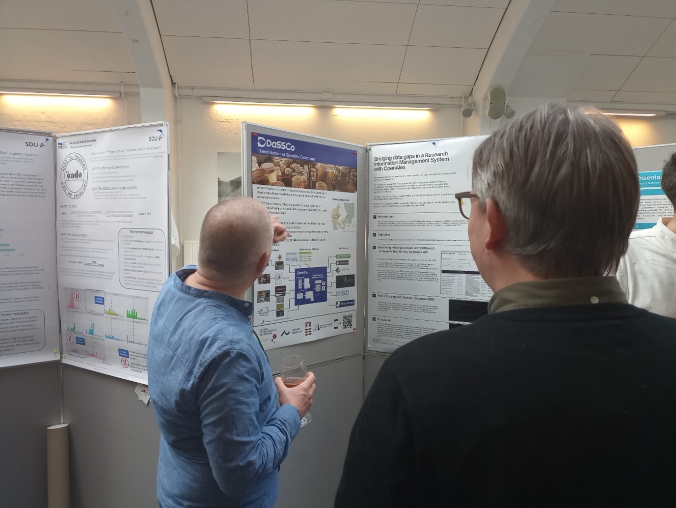 DaSSCo Project Manager showing DaSSCo poster at conference